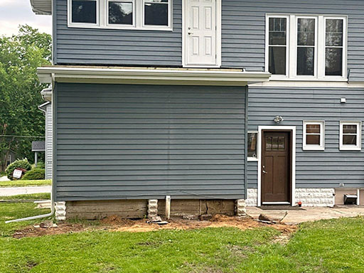 a house with before a deck installation