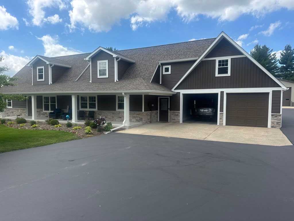 gray house in northwest indiana after siding contractor improved appearance