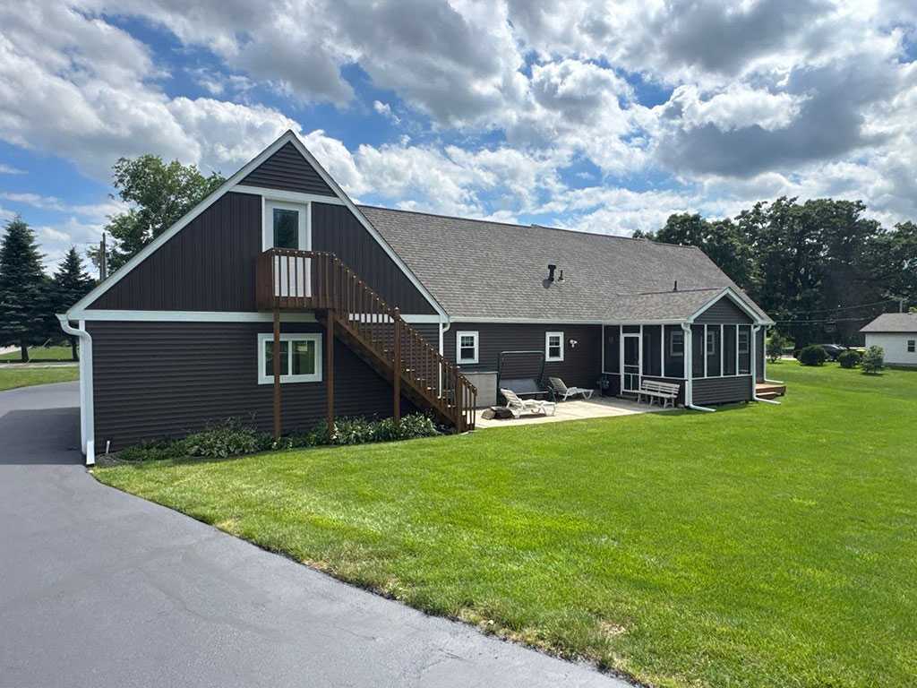 gray house in northwest indiana after siding contractor improved appearance