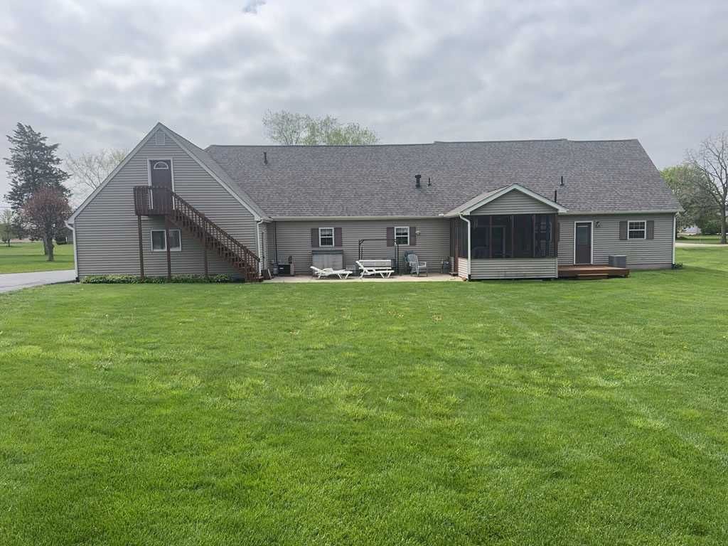 gray house in northwest indiana with dirty siding