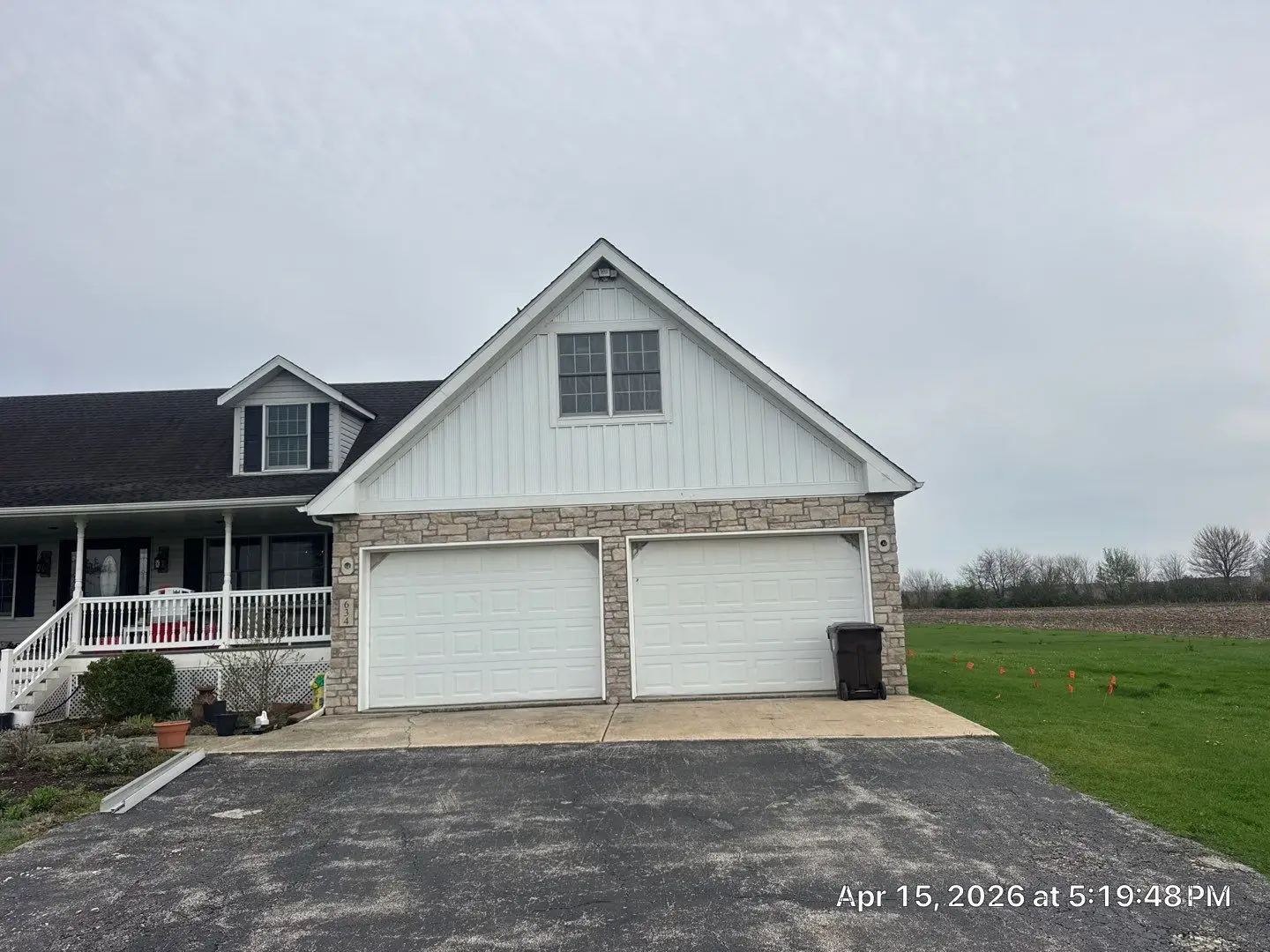 Front exterior view of LaCrosse garage stone and board and batten update