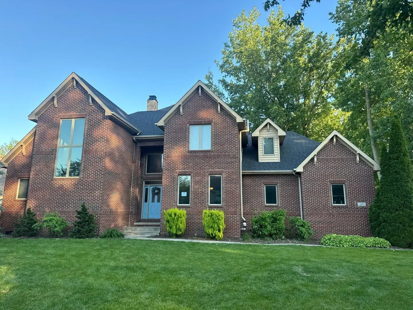 Front exterior view of Chesterton Moire Black house reroof
