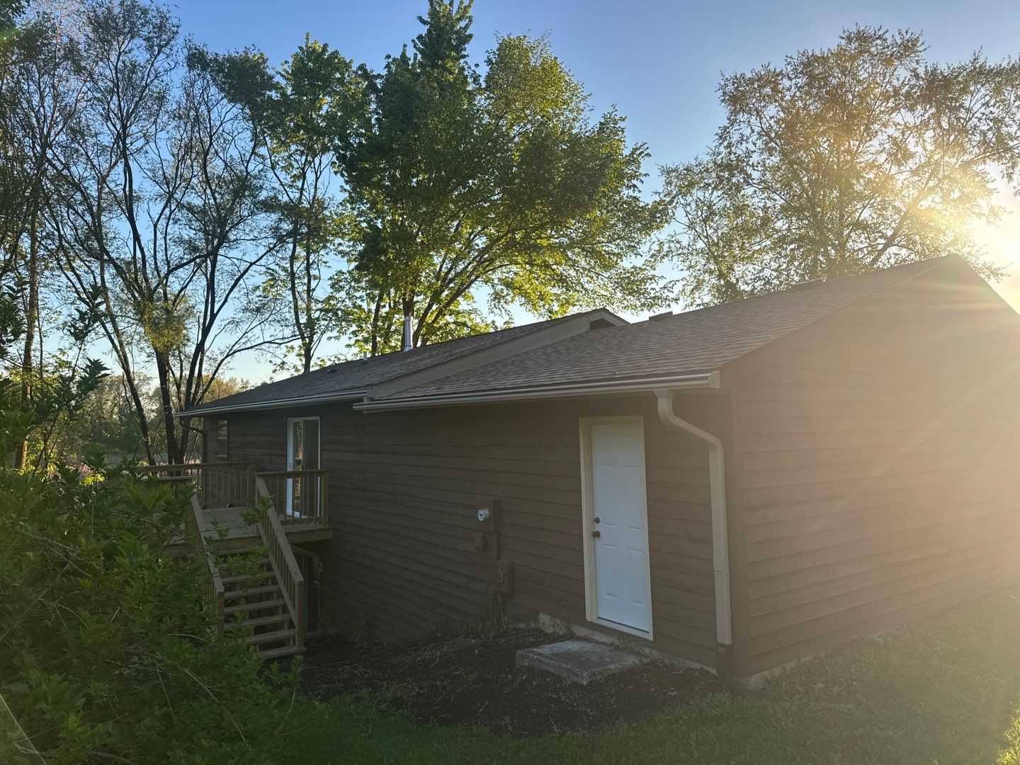 Front exterior view of Valparaiso reroof with gutters, downspouts, and fascia