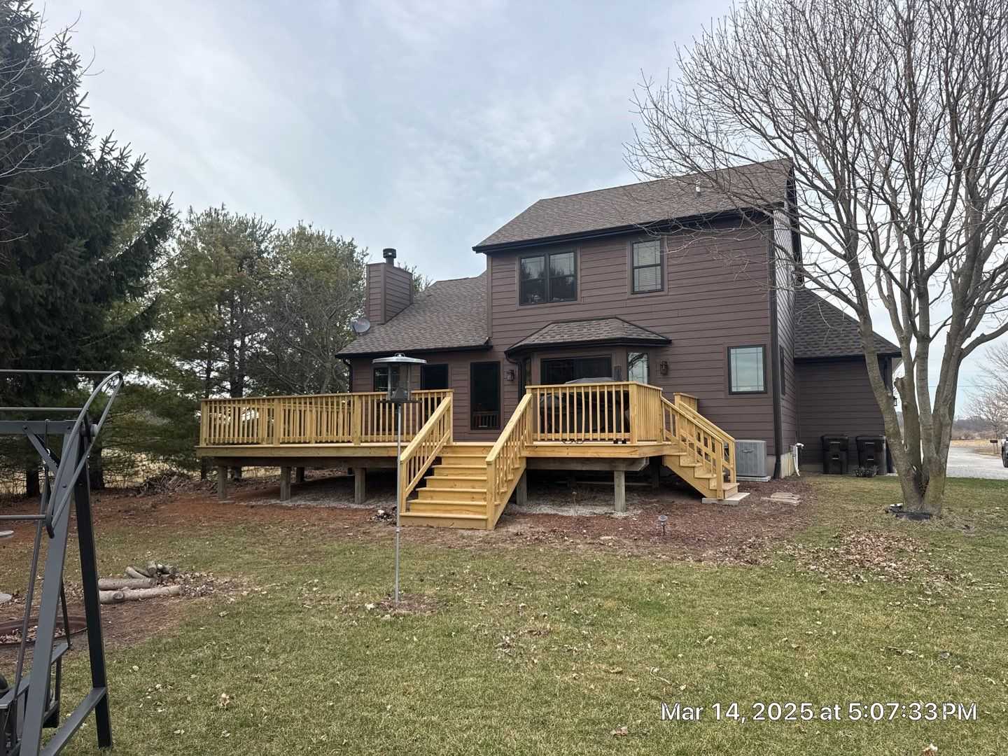 Additional deck view of Westville siding, stone, windows, doors, and deck project